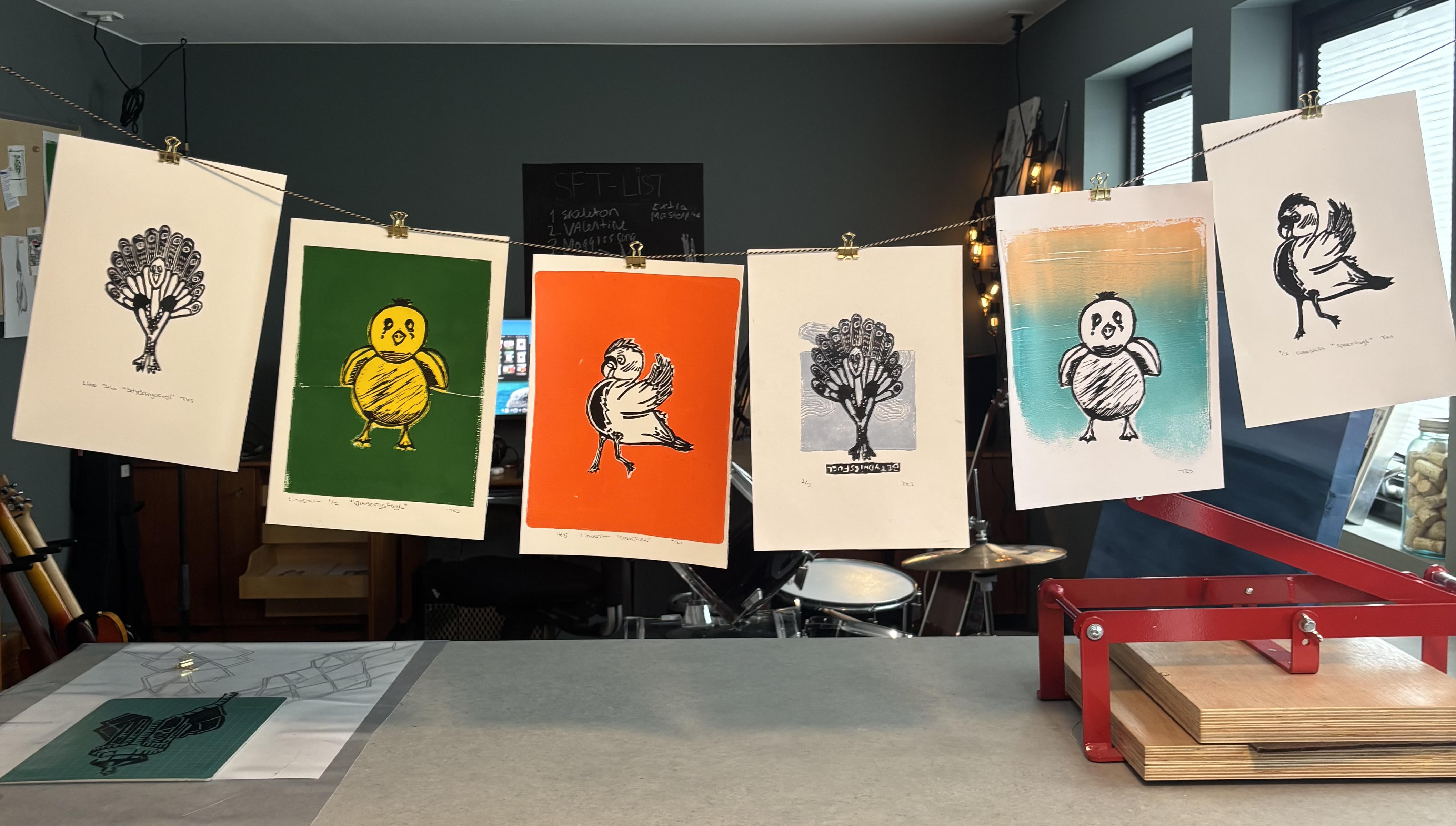 Birds on the Wire — lino prints hanging in studio